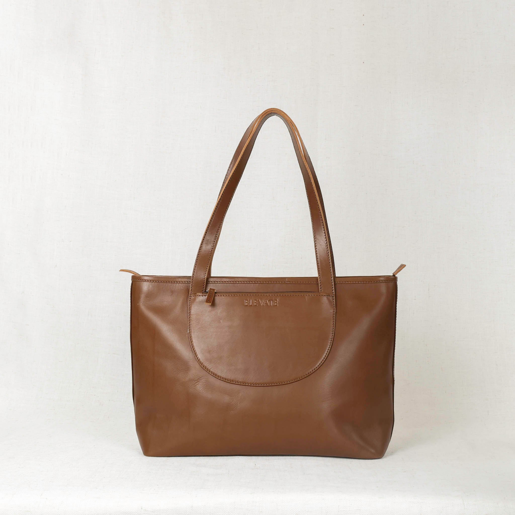 Inside view of the Tara Tote - Premium Leather Tote With Laptop Sleeve, featuring spacious compartments for organization.