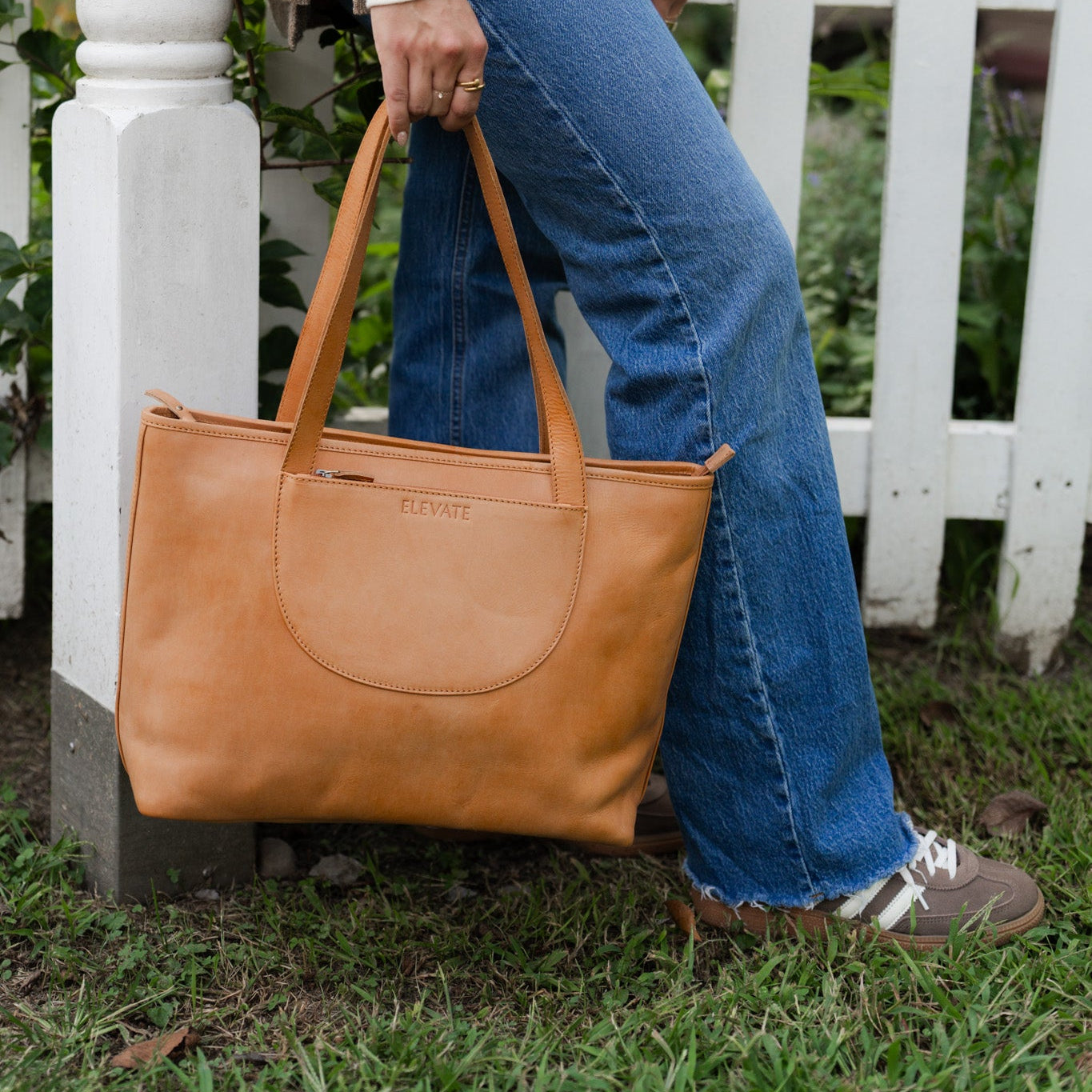 Detail shot of full-grain leather on the Tara Tote - Premium Leather Tote With Laptop Sleeve highlighting its texture.