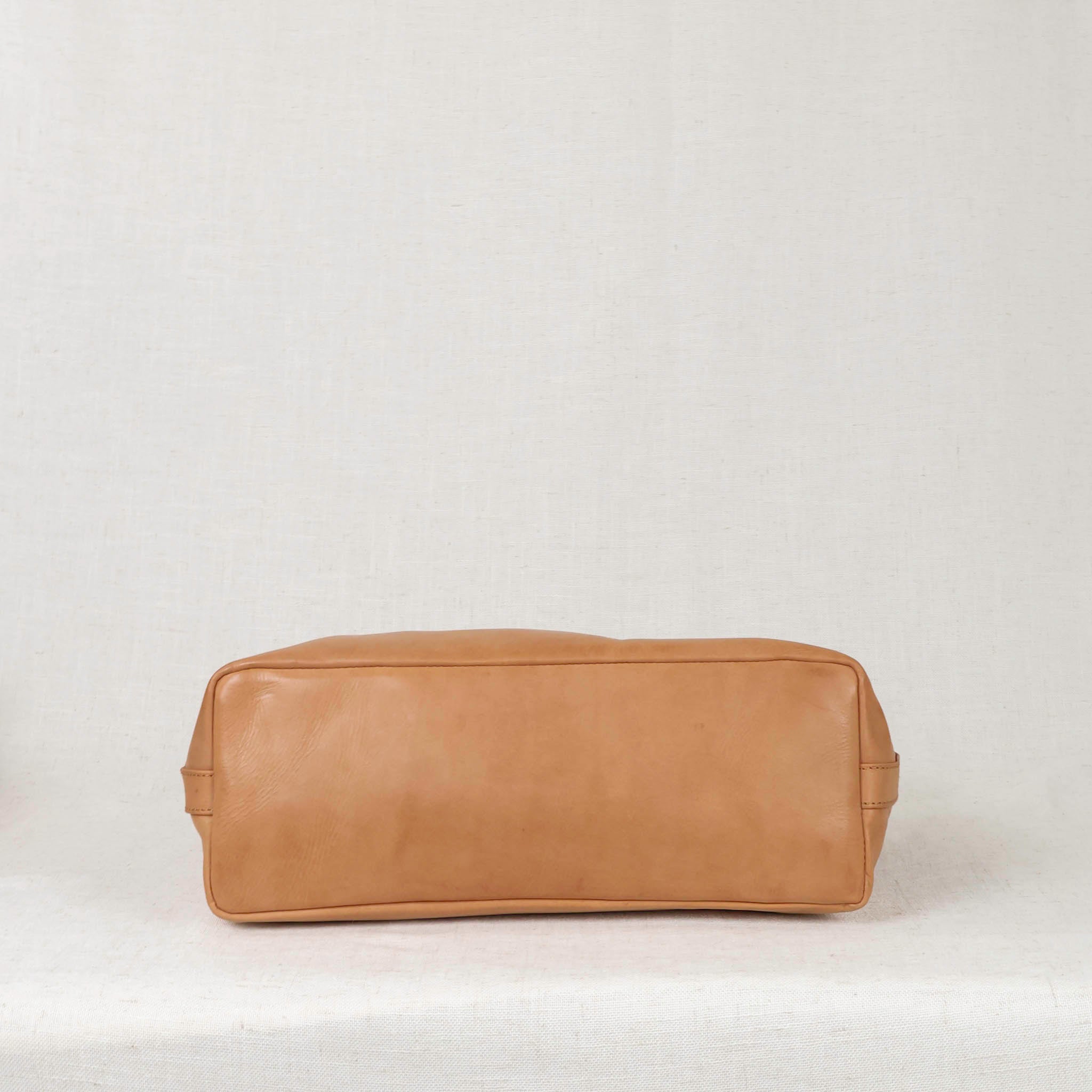 Handcrafted detail on the Tara Tote - Premium Leather Tote With Laptop Sleeve, emphasizing its unique craftsmanship.
