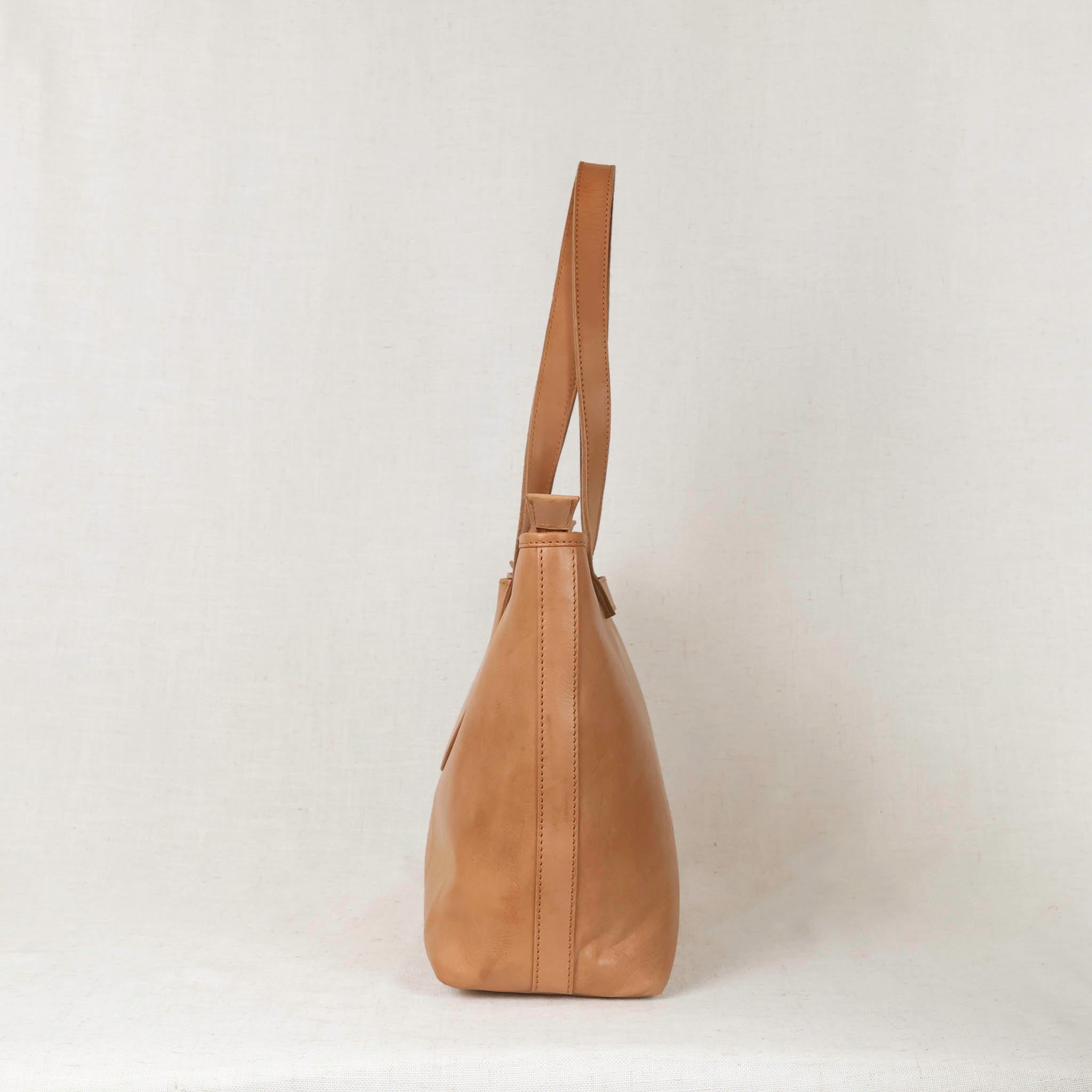 Different angles of the Tara Tote - Premium Leather Tote With Laptop Sleeve, showcasing its versatility and style.