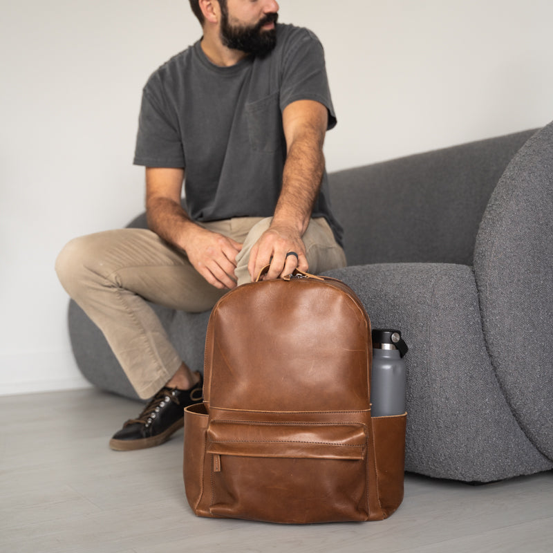 Commuter Backpack displayed with luggage strap, highlighting its travel-friendly backpack features.