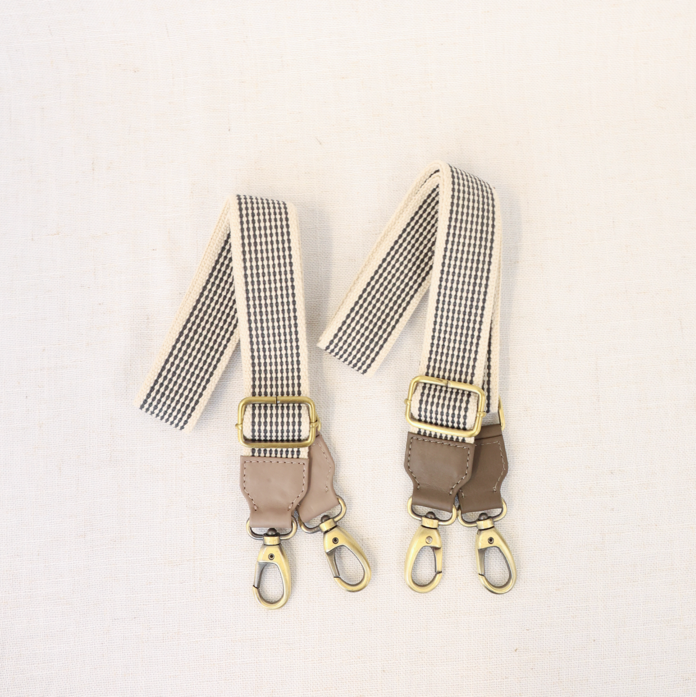 Close-up of the Woven Crossbody Bag Strap showcasing premium full-grain leather accents and durable brass hardware.