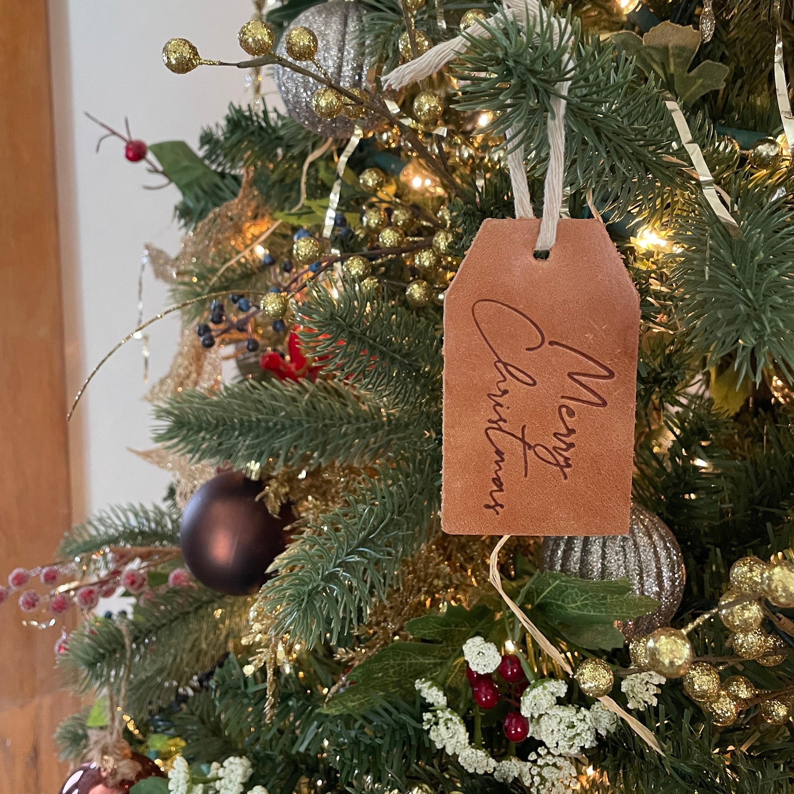 Leather Gift Tag by Elevate on a tree